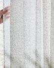 Natural woven sheer voile curtain panel with yard leaf pattern by Riva Home, soft furnishings for light filtering windows.