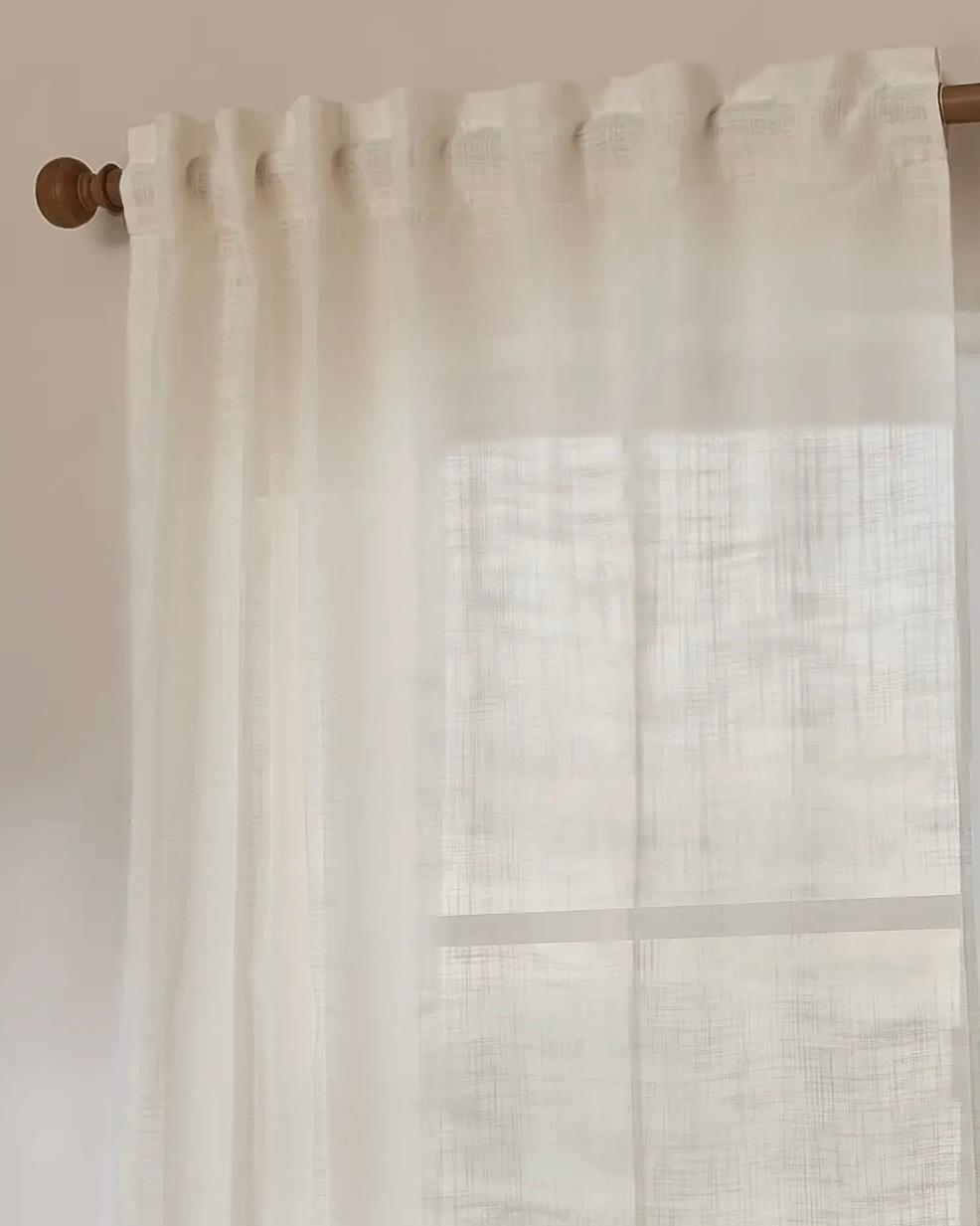 Riva Home Yard White Woven Sheer Voile Curtain Panel hanging in a window, showcasing light, airy soft furnishings for home decor.