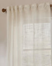 Riva Home Yard White Woven Sheer Voile Curtain Panel hanging in a window, showcasing light, airy soft furnishings for home decor.