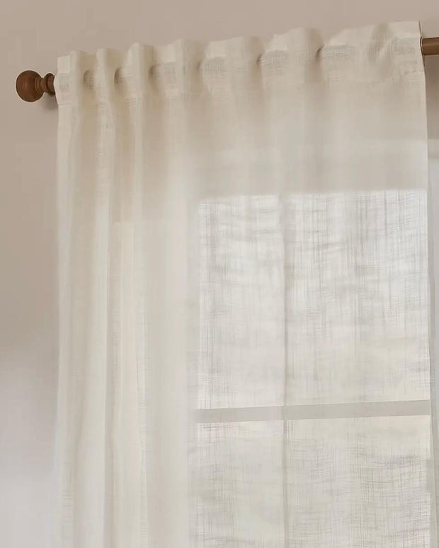 Riva Home Yard White Woven Sheer Voile Curtain Panel hanging in a window, showcasing light, airy soft furnishings for home decor.
