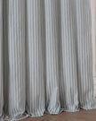 Ocean blue and black striped blackout eyelet curtains from Riva Home, showcasing soft furnishings with stylish eyelet tops.
