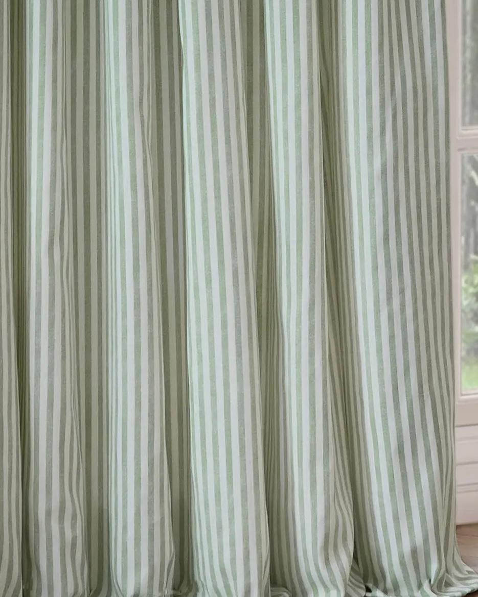 Sage green and black striped blackout eyelet curtains from Riva Home, soft furnishings with a stylish striped pattern and eyelet top.
