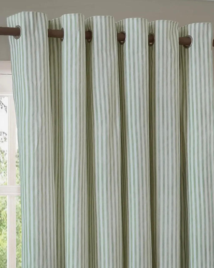 Sage green and black striped blackout eyelet curtains from Riva Home, soft furnishings with eyelet top design for bedroom or living room.