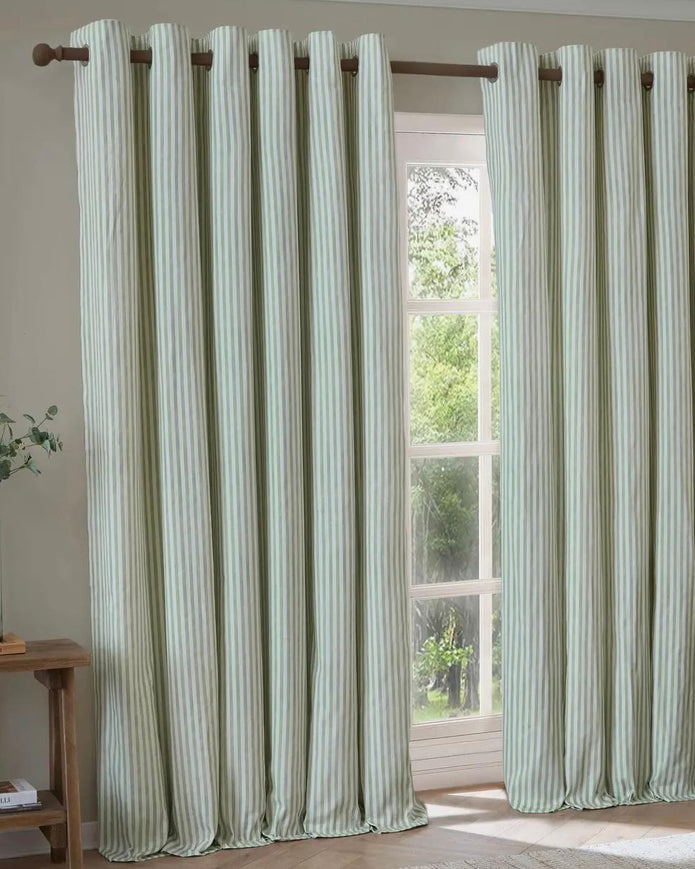 Green and black striped Yard Sage Green blackout eyelet curtains from Riva Home, soft furnishings with eyelet top design.