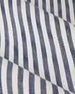 Navy blue striped blackout eyelet curtains from Riva Home, soft furnishings with black and navy pattern and eyelet top design.