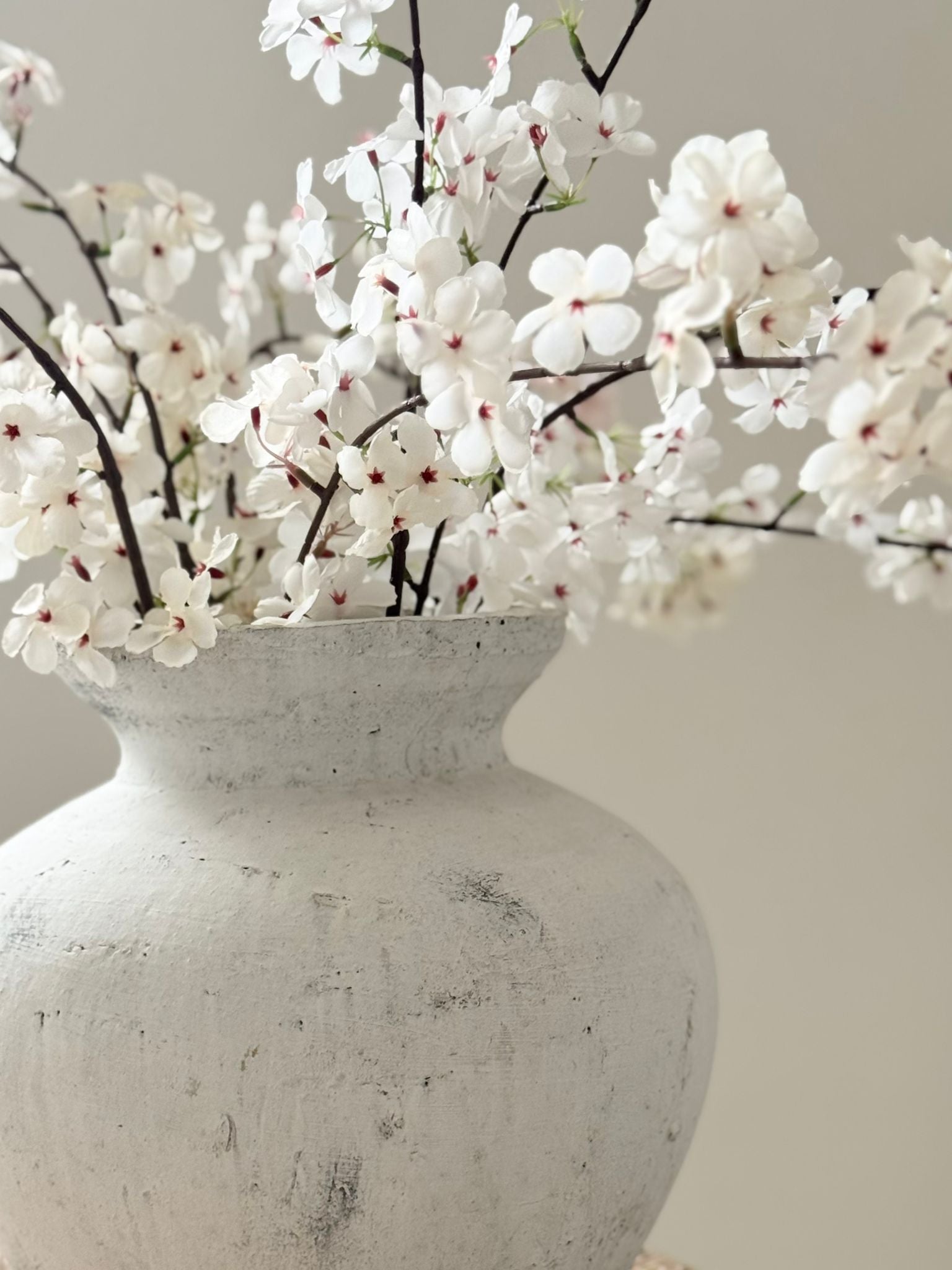 Artificial tall white cherry blossom stem from Starlight Express, featuring delicate white blossoms on a natural-looking stem.