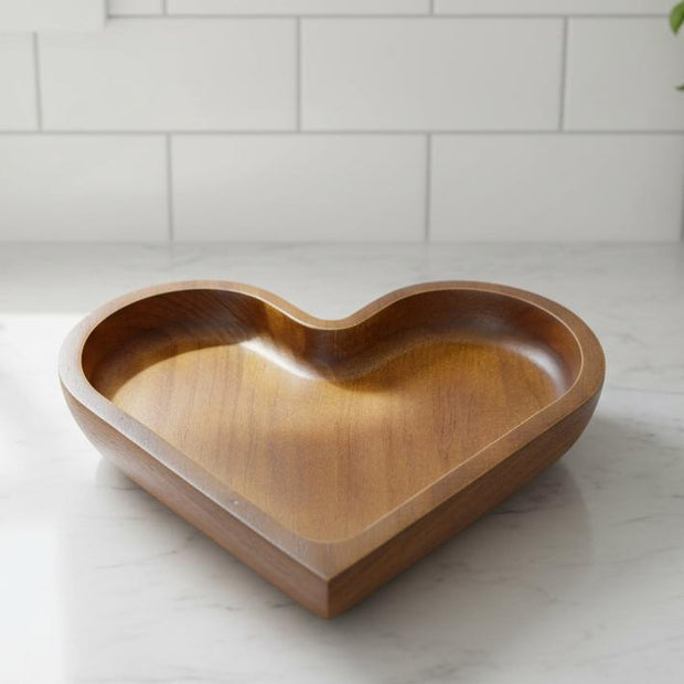 Small dark wood heart dish from Starlight Express, a charming kitchen and dining accessory for holding small items or decor.