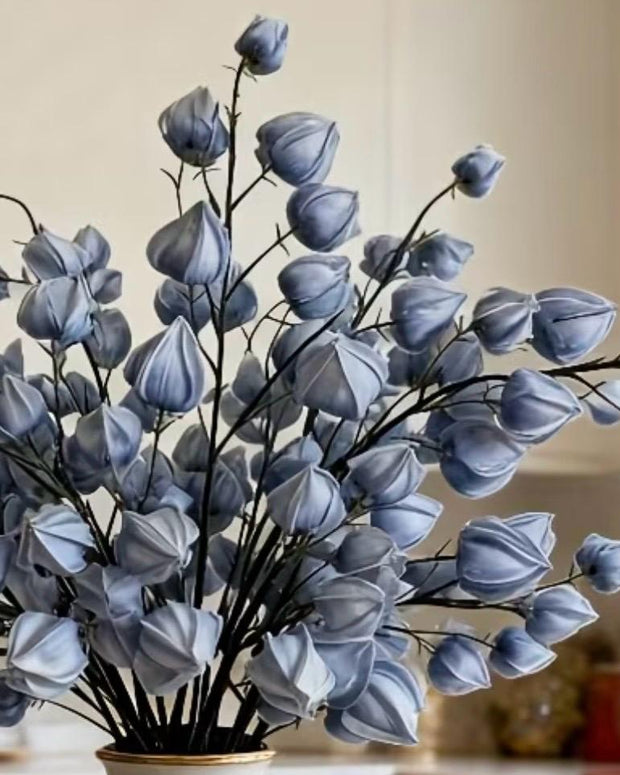 Artificial dusky blue lantern stem from Starlight Express, featuring realistic faux plant with vibrant blue lantern-shaped flowers.
