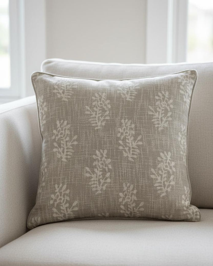 Beige block flower cushion cover by Malini, soft furnishings with a floral pattern, shown on a decorative cushion.