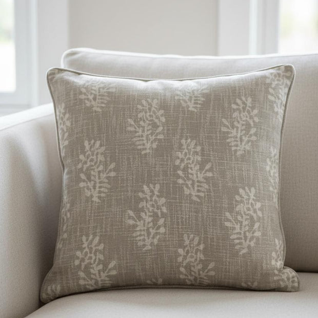 Beige block flower cushion cover by Malini, soft furnishings with a floral pattern, shown on a decorative cushion.