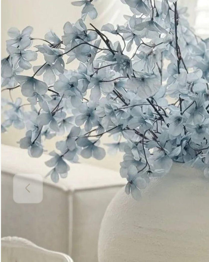 Artificial Ocean Blue Blossom Stem from Starlight Express, showcasing vibrant blue flowers and realistic green leaves.