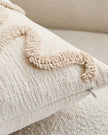 Cream and beige bow square boucle cushion cover from Starlight Express, soft furnishings with textured boucle fabric.