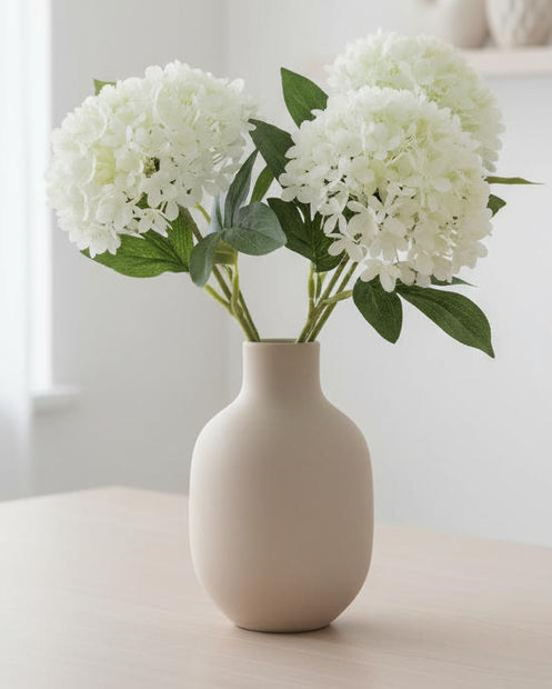 Artificial white mini hydrangea stem by Gisela Graham, showcasing realistic white hydrangea blooms on a slender stem.