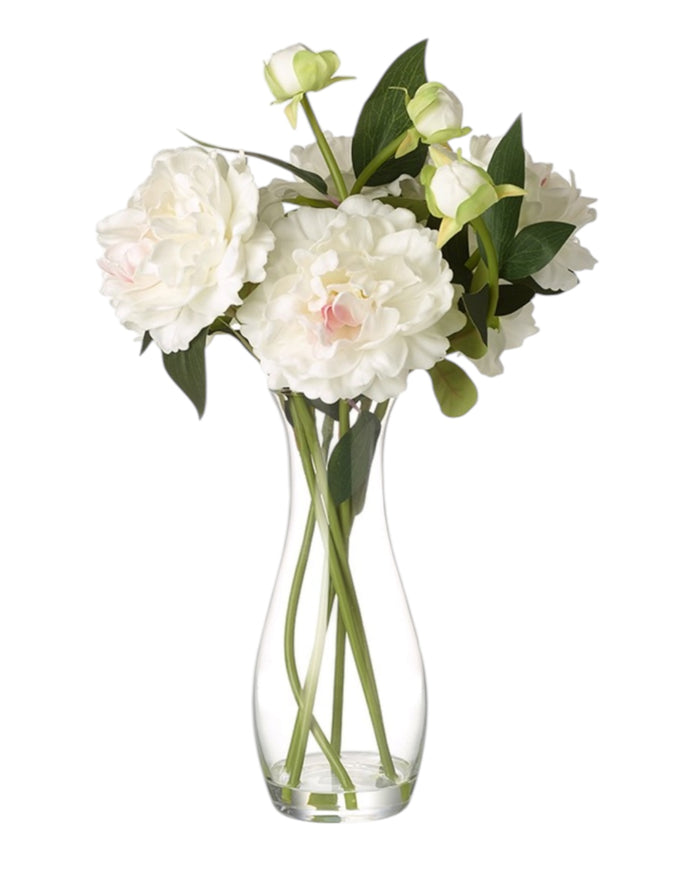 Tall white peony artificial plant arrangement in a clear glass vase by Heaven Sends, featuring lush white peony blooms and green foliage.