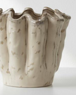 Neutral ceramic wavy vase, a stylish home décor piece by Heaven Sends, featuring a smooth, flowing design ideal for modern interiors.