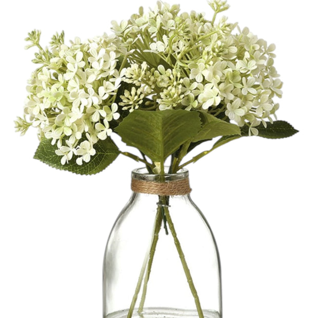 Artificial white flower arrangement in a glass vase, decorative floral display by Heaven Sends.