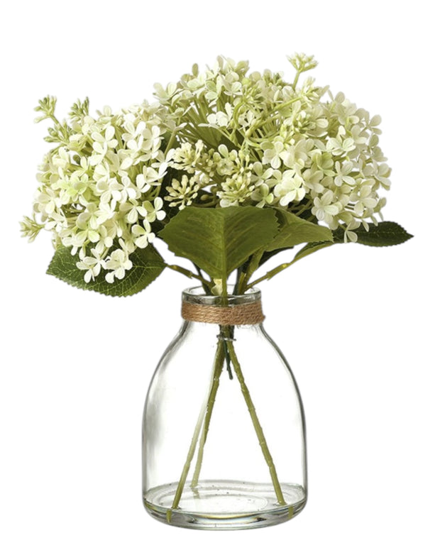 Artificial white flower arrangement in a glass vase, decorative floral display by Heaven Sends.