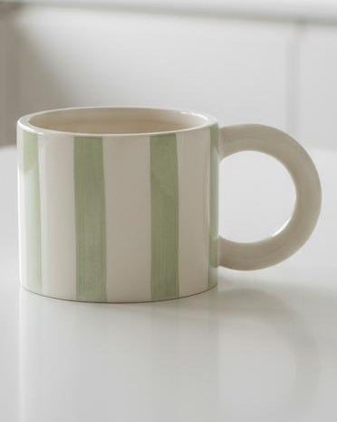 Sage green and white striped ceramic mug from Heaven Sends, featuring a classic design and a comfortable handle.
