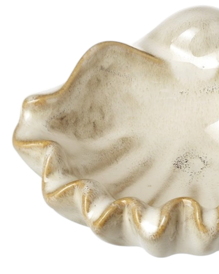 Beige ceramic shell bowl for home décor, decorative pottery piece by Heaven Sends, featuring a smooth shell design.
