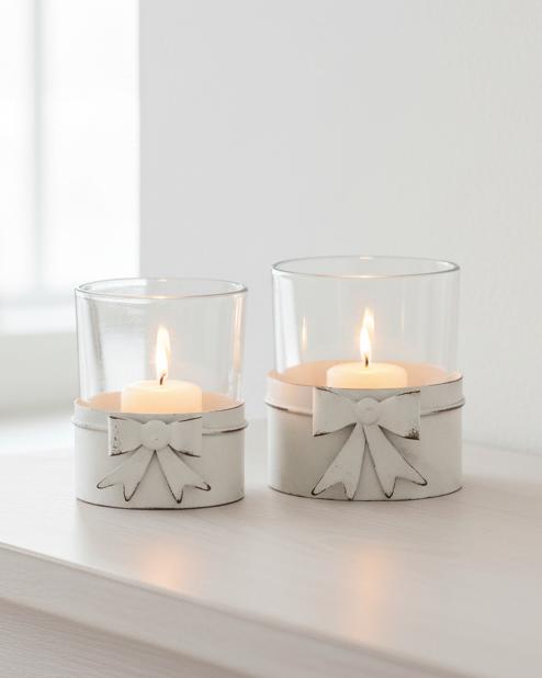 White metal bow hurricane candle holder for tealights, decorative home décor piece by Heaven Sends.