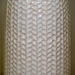 White leaf-patterned ceramic vase with a glossy finish and narrow bottle-shaped neck