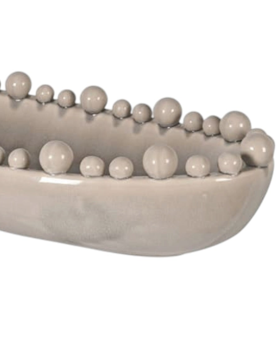 Large beige Coach House oval bowl with bobble-edged design, ideal for home decor and decorative table settings.
