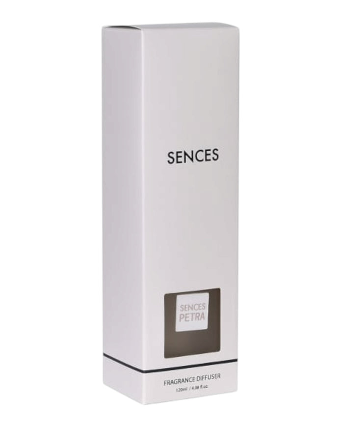 White Petra Reed Diffuser with travertine ball top in pink pepper scent by Coach House, showcasing the elegant home fragrance design.