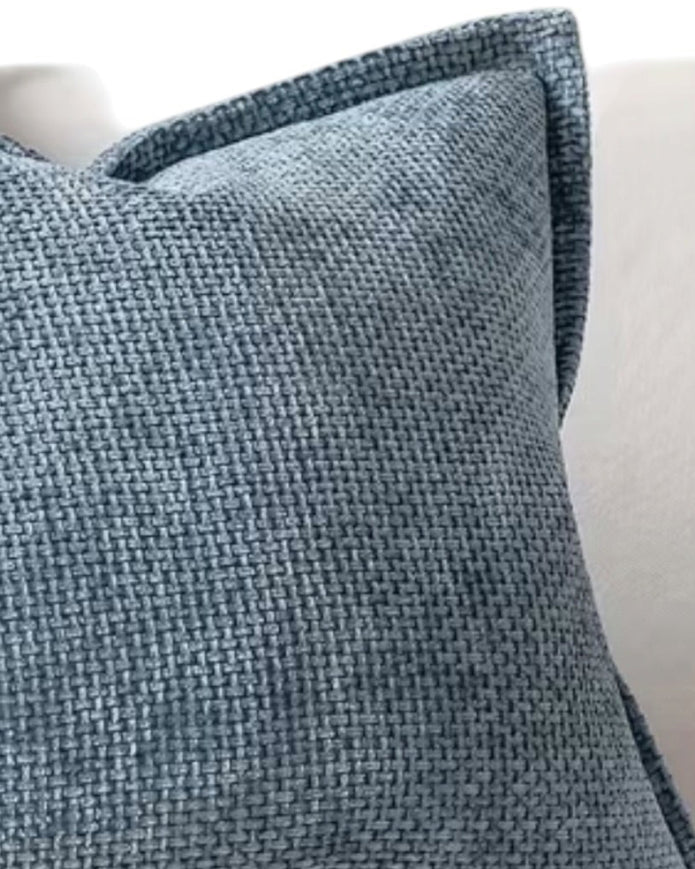 Blue woven denim cushion cover with edge detail, soft furnishings by Starlight Express, showcasing textured fabric and stylish design.