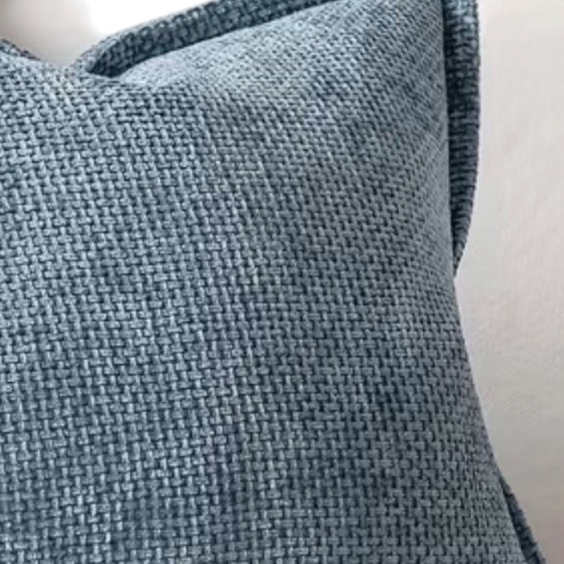 Blue woven denim cushion cover with edge detail, soft furnishings by Starlight Express, showcasing textured fabric and stylish design.