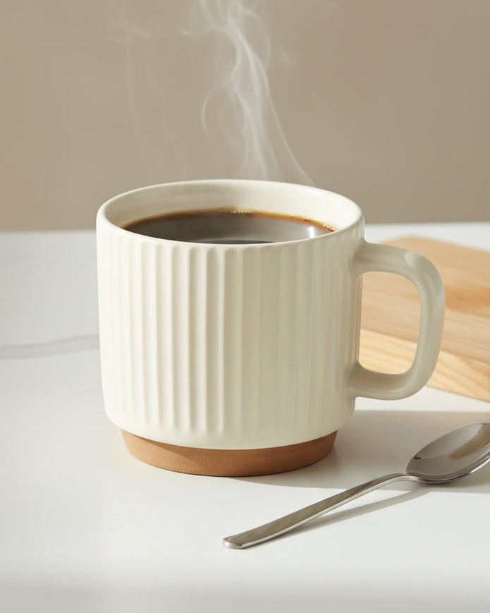 Cream and neutral ribbed ceramic mug from Starlight Express, ideal for kitchen and dining use, with a textured ribbed design.