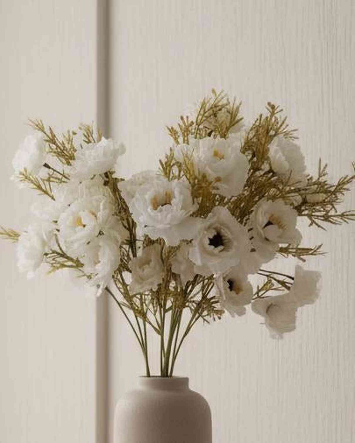 Artificial white and neutral poppy flower stem from Starlight Express, featuring realistic fabric petals and green stem.