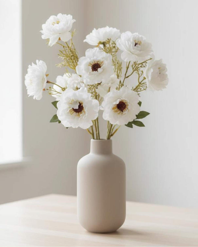 Artificial white and neutral poppy flower stem from Starlight Express, featuring realistic blooms and green foliage.