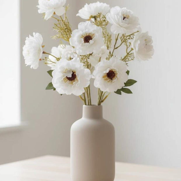 Artificial white and neutral poppy flower stem from Starlight Express, featuring realistic blooms and green foliage.