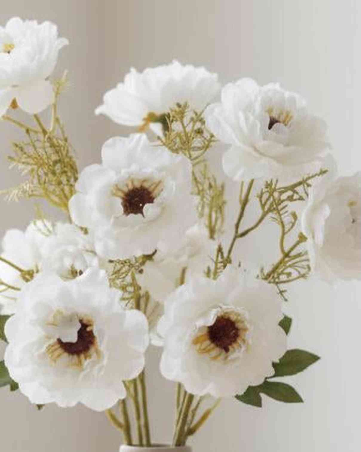 Artificial white and neutral poppy flower stem from Starlight Express, featuring realistic petals and green foliage.