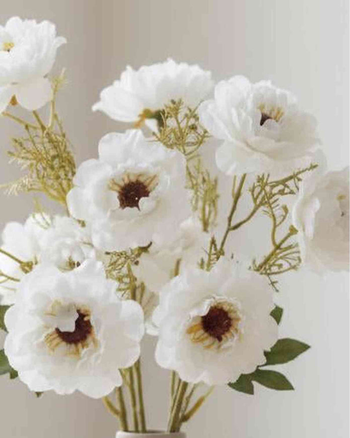 Artificial white and neutral poppy flower stem from Starlight Express, featuring realistic petals and green foliage.