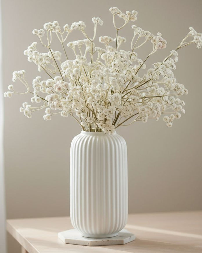 Artificial Cream Neutral Gypsophila stem from Starlight Express, featuring delicate white blossoms on a realistic plant stem.