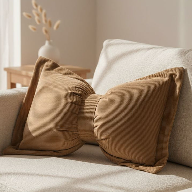 Neutral brown corduroy striped bow cushion from Starlight Express, featuring soft, textured fabric and decorative bow detail.