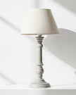 Pella wooden table lamp by Hill Interiors with a classic design, featuring a smooth wooden base and fabric lampshade.