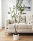 Medium artificial faux olive tree by Hill Interiors, showcasing realistic green leaves and a sturdy trunk for home decor.