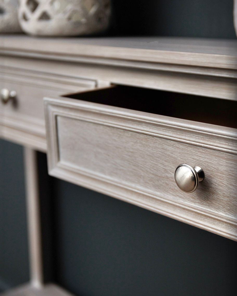 Hill Interiors Serene Collection four-drawer console table, modern furniture piece with sleek wood finish and minimalist design.