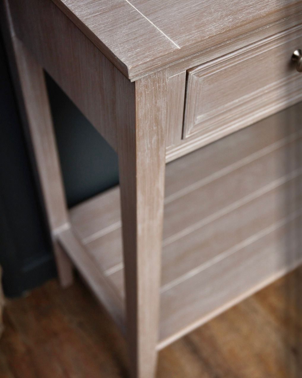 Hill Interiors Serene Collection four-drawer console table with sleek wood finish, ideal for entryways or living rooms.