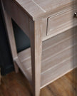 Hill Interiors Serene Collection four-drawer console table with sleek wood finish, ideal for entryways or living rooms.