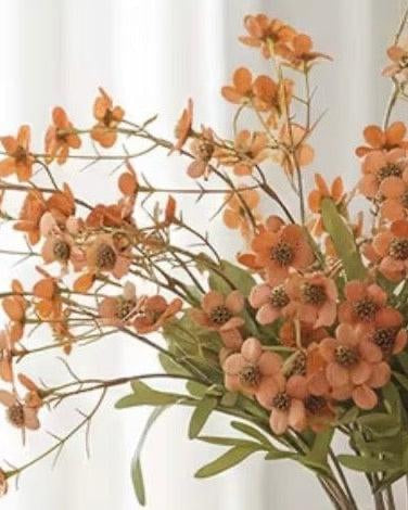 Artificial Daisy Flower Stem in orange from Starlight Express, showcasing vibrant, realistic artificial plant with multiple flower blooms.