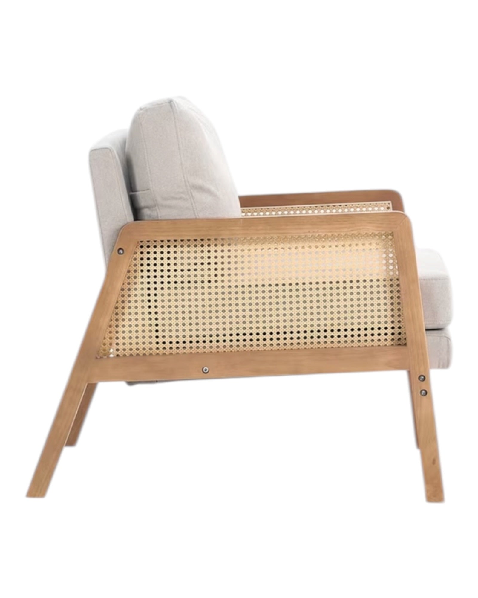 Beige linen upholstered rattan armchair with a natural wood frame, styled for a cozy living room setting.