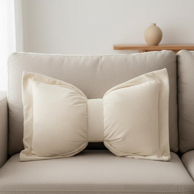 Cream neutral corduroy striped bow cushion from Starlight Express, soft furnishings with a plush, textured fabric and decorative bow.