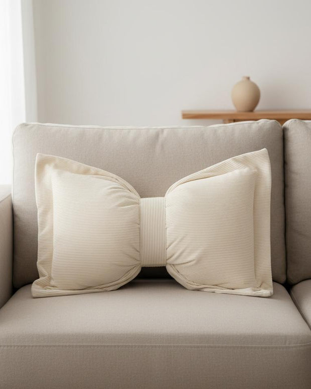 Cream neutral corduroy striped bow cushion by Starlight Express, soft furnishings with a plush, textured fabric and decorative bow detail.