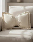Cream neutral corduroy striped bow cushion from Starlight Express, soft furnishings with a plush fabric and decorative bow detail.