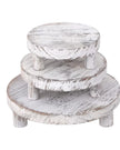 Set of three white washed round risers for home decor displays by Starlight Express, featuring natural wood finish and varying heights.