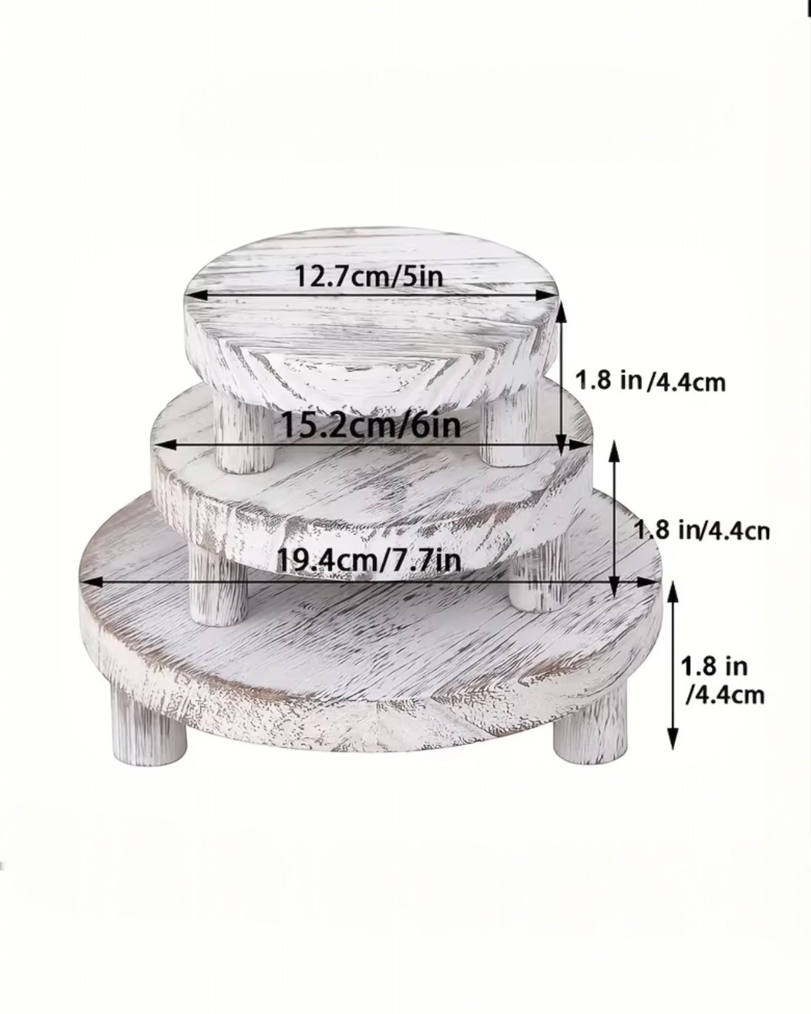 Set of three white washed round risers for home decor, featuring natural wood finish and versatile display options.