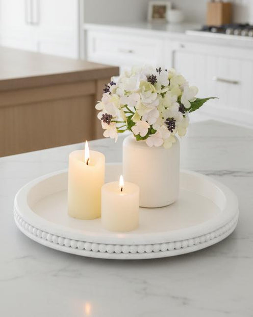 White wood beaded round tray for home decor by Starlight Express, featuring a stylish beaded edge and smooth surface.